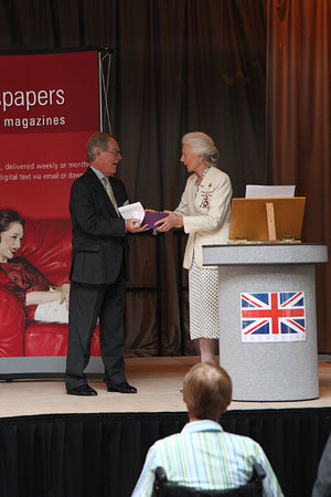 Mr Peter Driver, Chairman of National Talking Newspapers & Magazines, receives the Queen's Award for Voluntary Service on behalf of the charity from Mrs Phyllida Stewart-Roberts OBE, Lord Lieutenant of East Sussex.