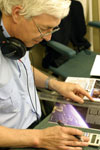 Tom Kewell, a studio manager, editing a publication prior to recording.